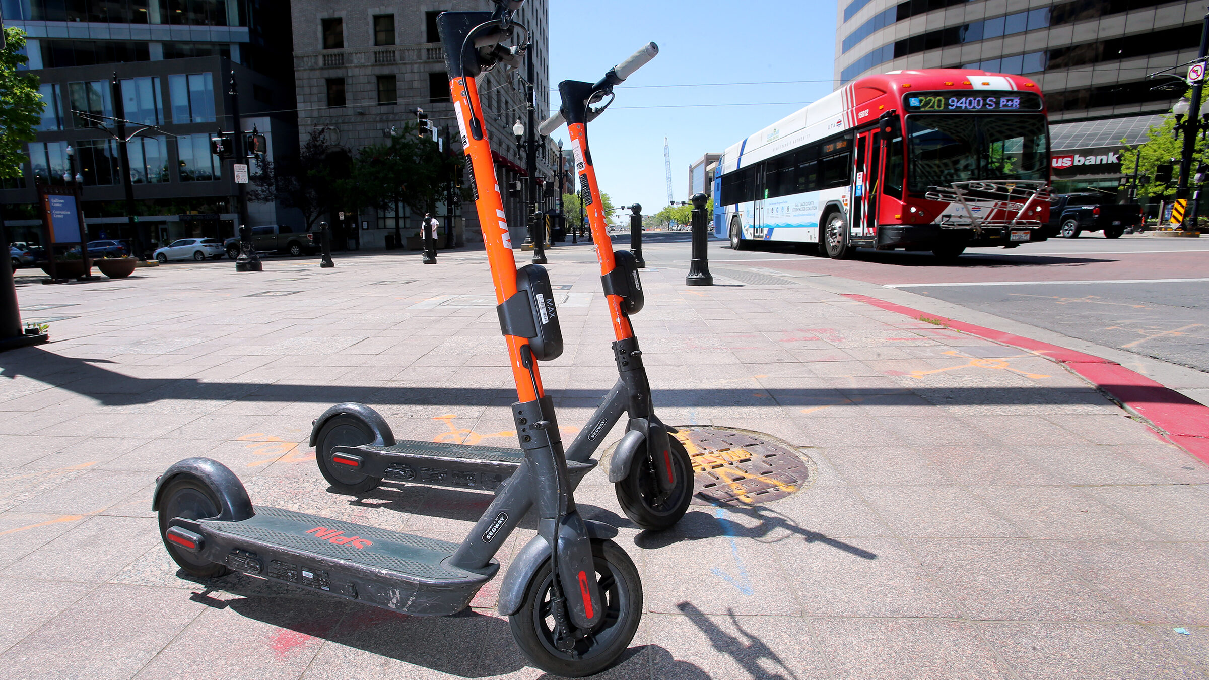 Two electronic scooters sit parked on Main Street and 200 South in Salt Lake City on Wednesday, May...