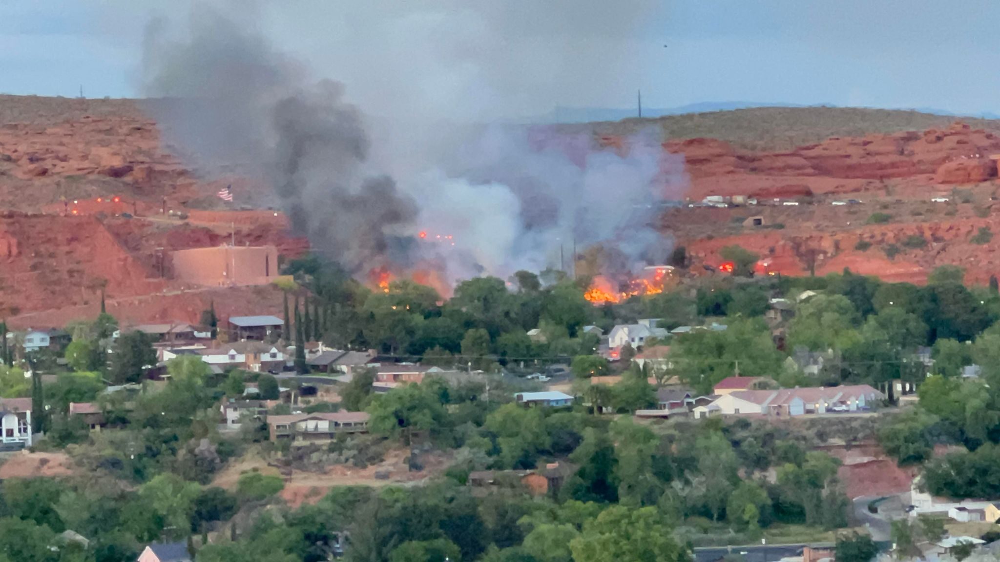 Smoke rises from a brush fire in St. George....