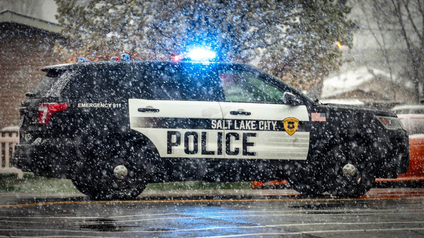 A Salt Lake City Police car parked with its lights on during a shooting investigation near 1050 Wes...