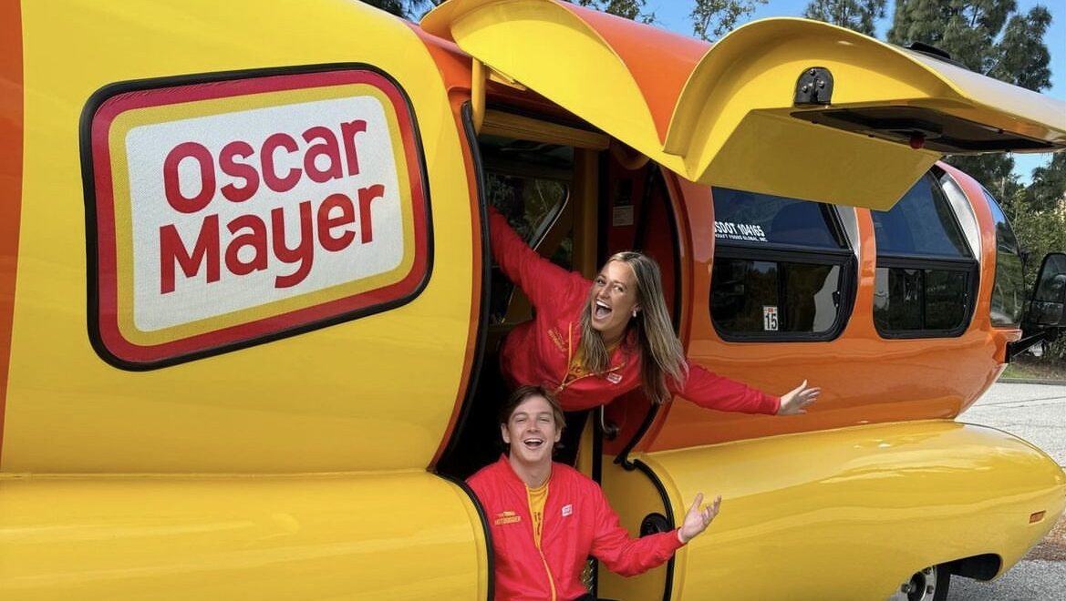 'BBQ' Braden Schroeder and 'Aioli' Anna Murphy say they're having a great time driving a big hot do...