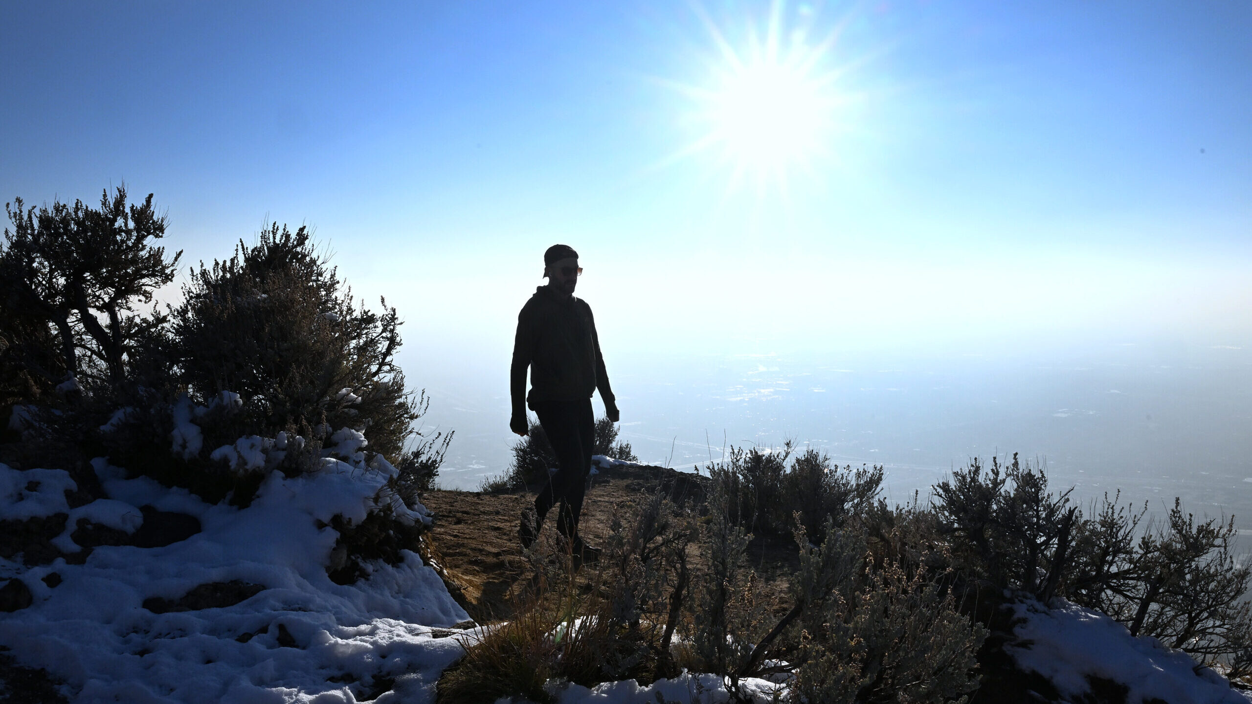 A hiker walks along the trail on Ensign Peak, Search and Rescue teams issue reminder about hiking s...