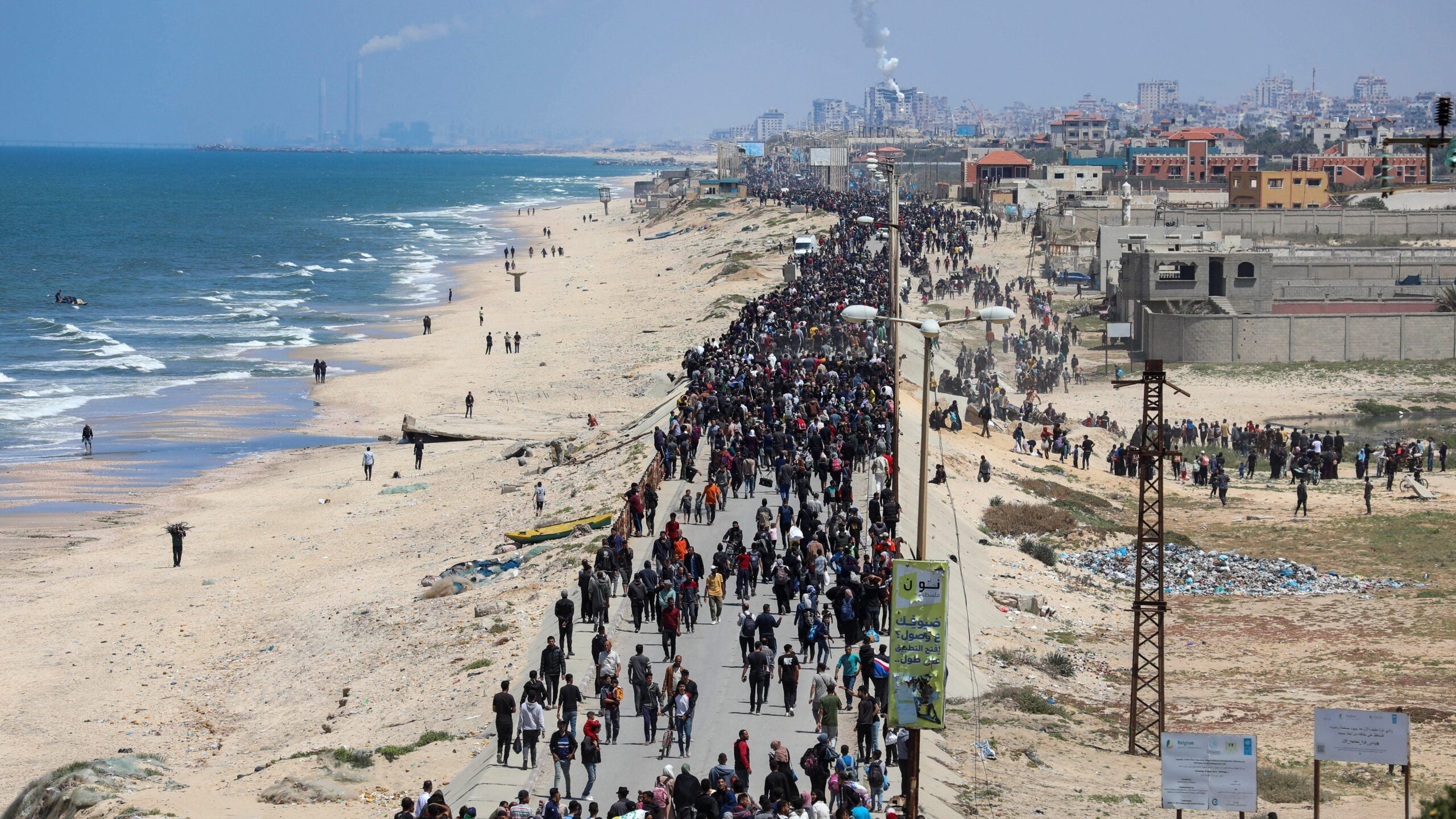 Palestinians displaced by Israel's military offensive head toward north Gaza in an attempt to retur...
