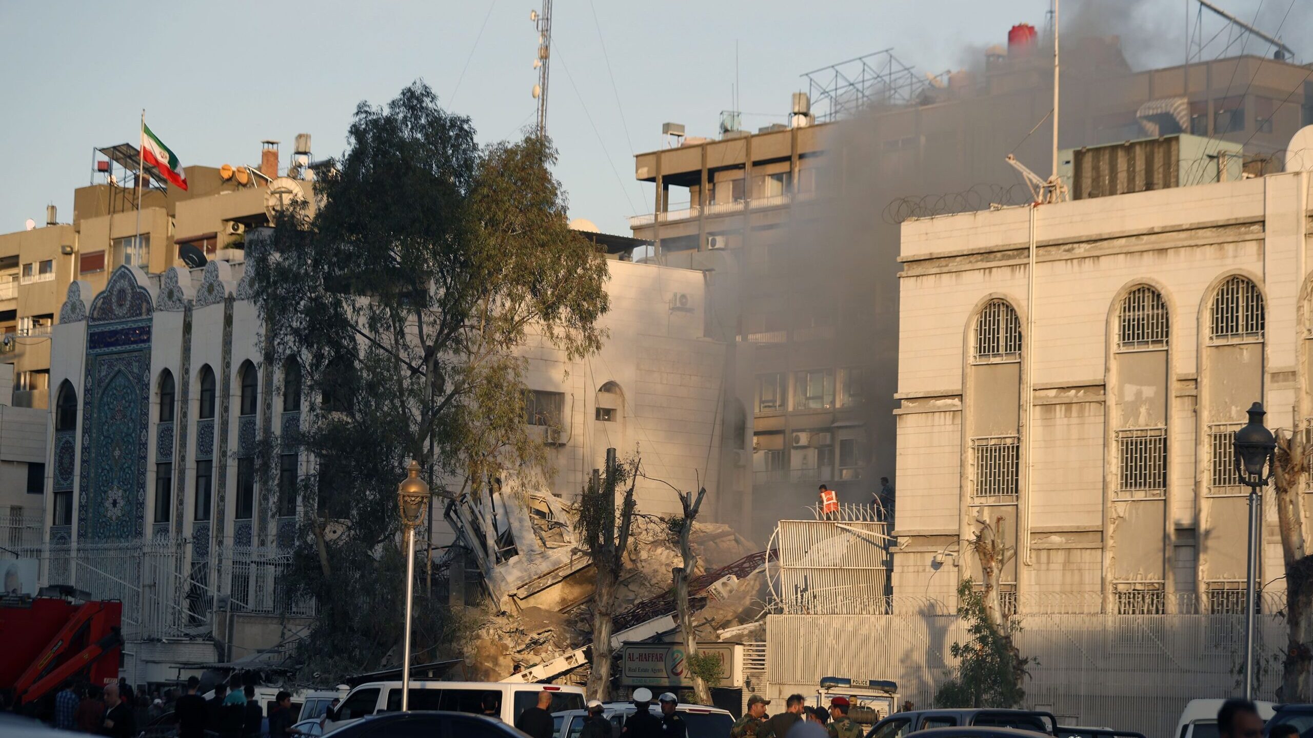 Emergency services work at a destroyed building hit by an air strike in Damascus, Syria on April 1....