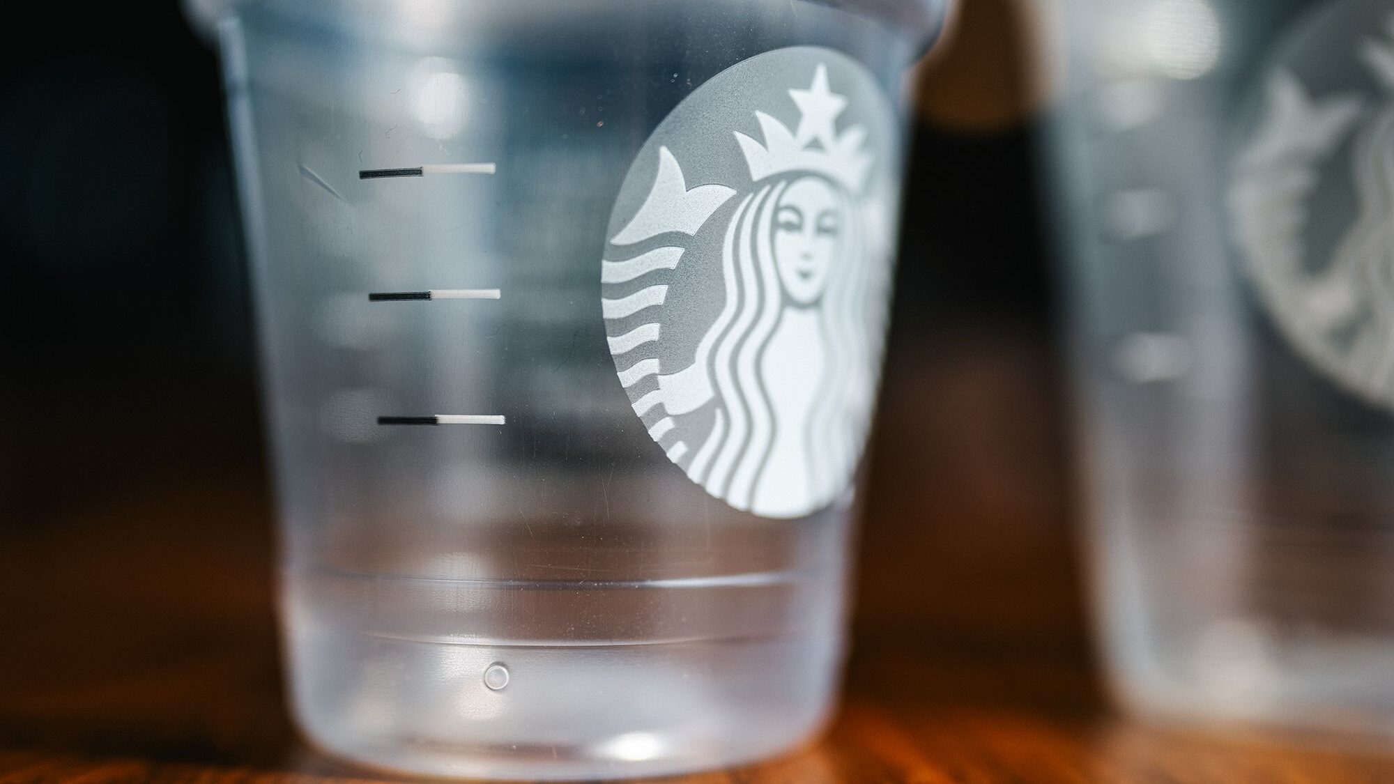 A clear plastic cup from Starbucks features new black and white fill lines....