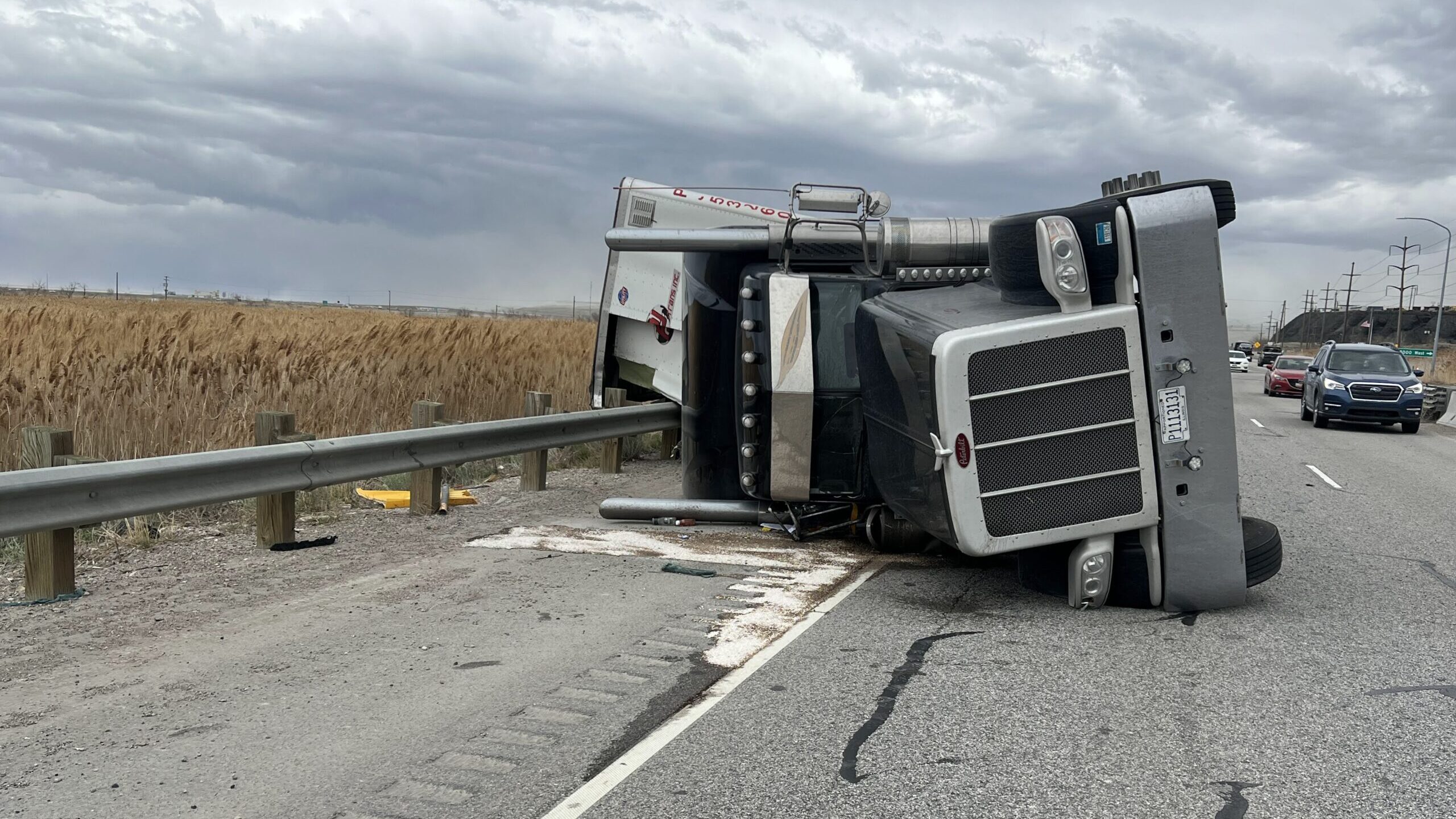 semi truck is rolled over on i-80 junction due to high winds...