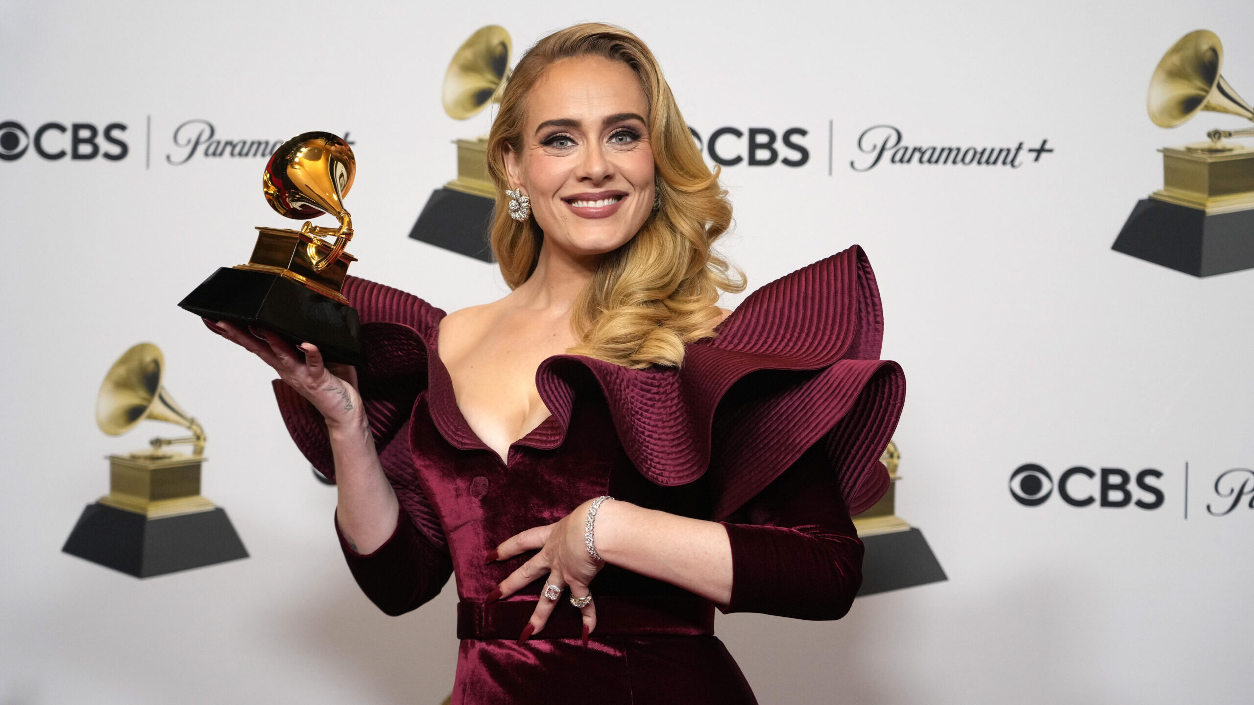 FILE - Adele, winner of the award for best pop solo performance for "Easy on Me," poses in the pres...