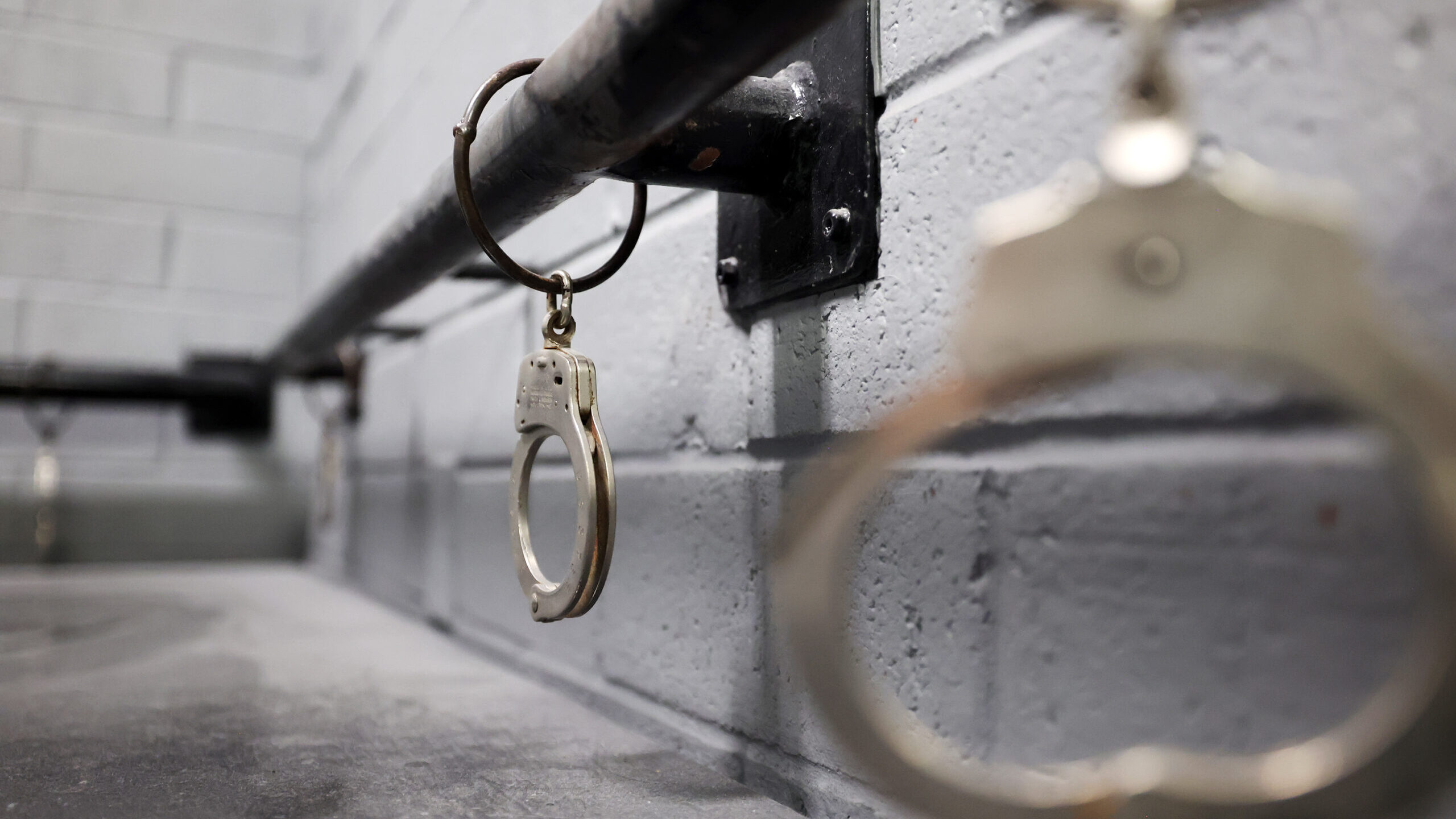 FILE - Handcuffs hang from a rail inside the Wasatch entry as Gov. Spencer Cox, former Gov. Gary He...