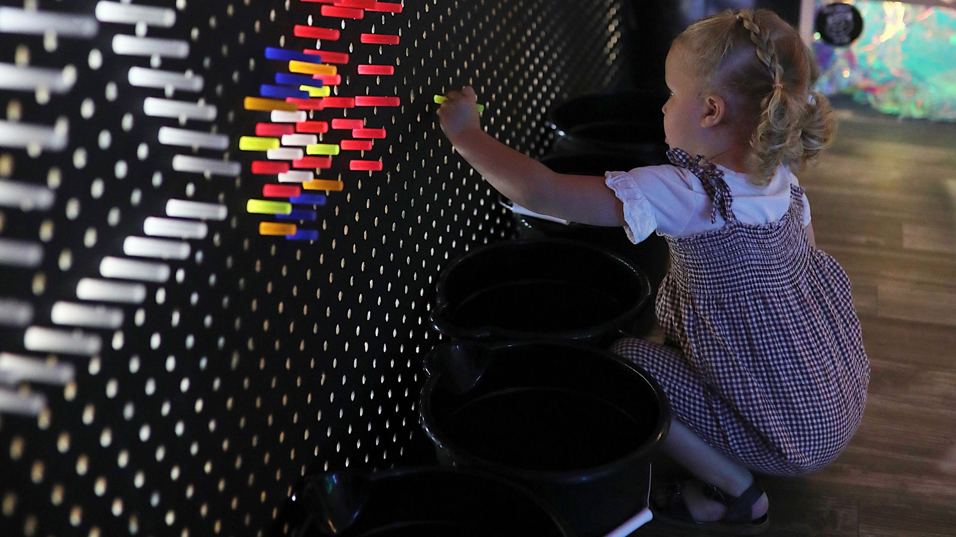 A child experiences an interactive art exhibit at "Dreamscapes," the business at the Shops at South...