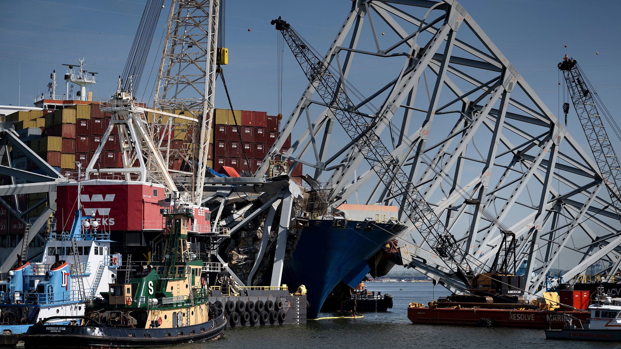 The cargo ship Dali is seen stuck in the remains of the Key Bridge as workers remove debris at the ...