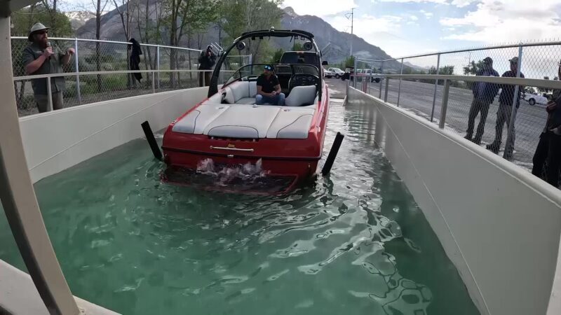 A quagga dip tank at Lake Powell, as a boat enters the tank to be decontaminated from quagga mussel...