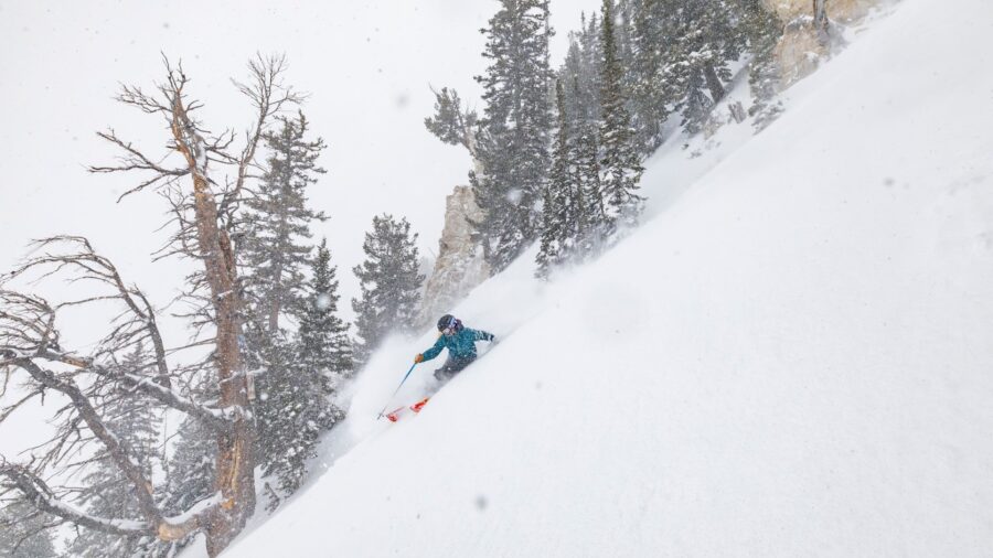 A skier cuts through snow at Snowbird Ski Resort in Little Cottonwood Canyon...