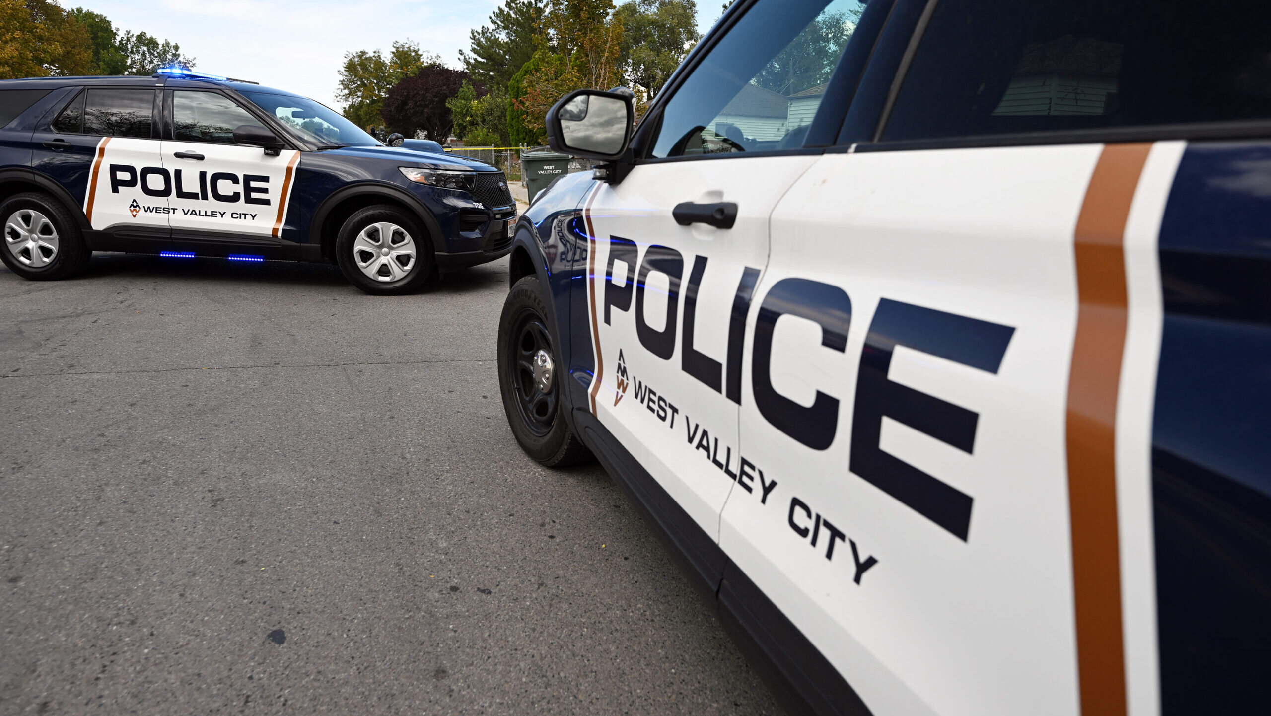 West Valley City police vehicles block the road as officers investigate on Tuesday, Sept. 19, 2023....