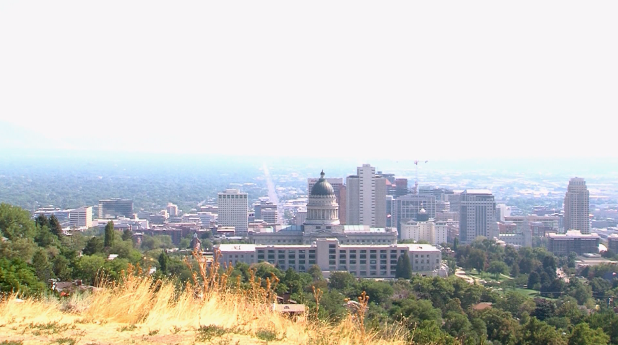 A view of the state Capitol and the Salt Lake City skyline. Ozone pollution and smoke from the wild...