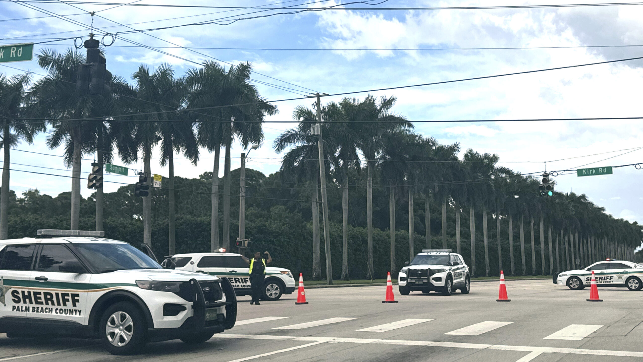 Sheriff vehicles are pictured near Trump International Golf Club, Sunday. Sept. 15, 2024, in West P...