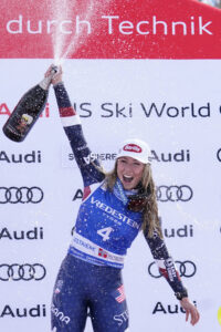 United States' Mikaela Shiffrin celebrates her 100th victory after an alpine ski, women's World Cup slalom, in Sestriere, Italy, Sunday, Feb. 23, 2025. (AP Photo/Piermarco Tacca)