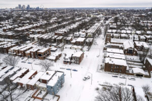 FILE - A pickup truck navigates snow-covered streets following a winter storm, Jan. 6, 2025, in St. Louis. (AP Photo/Jeff Roberson, File) climate change