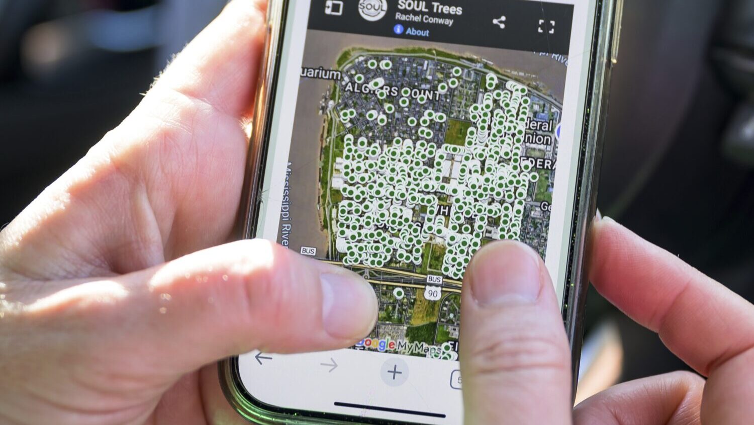 Susannah Burley, founding director of SOUL (Sustaining Our Urban Landscape), uses a map on the grou...