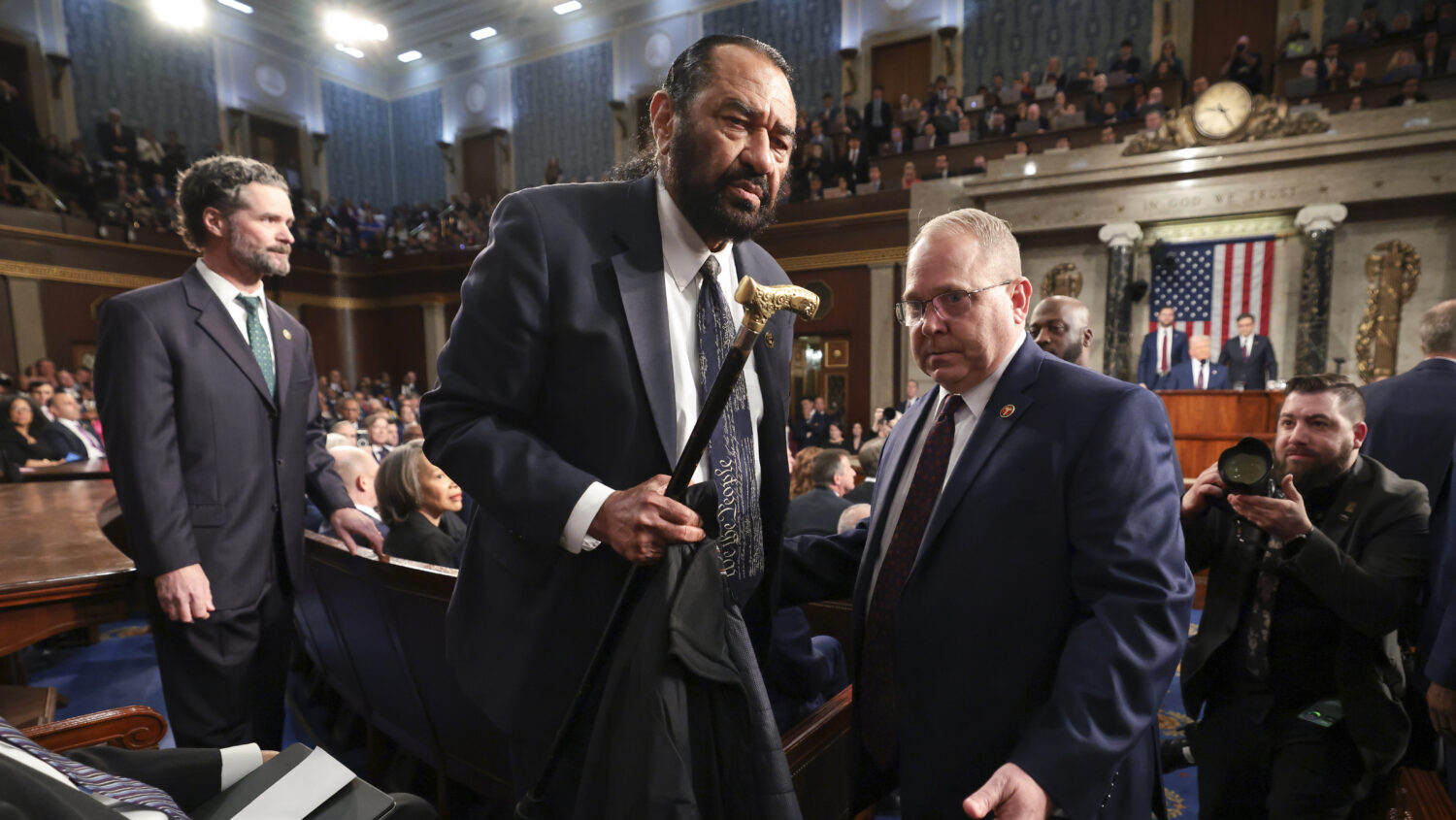 Rep. Al Green, D-Texas, is removed from the chamber as President Donald Trump addresses a joint ses...
