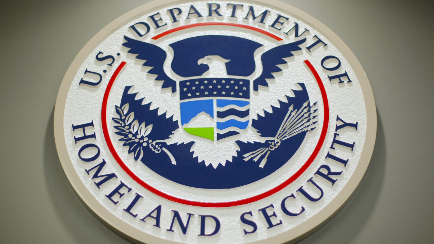 FILE - The Department of Homeland Security logo is seen during a news conference in Washington, Feb...