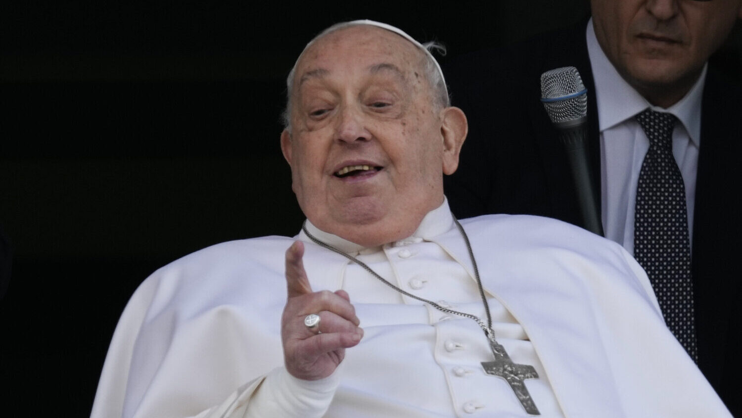 Pope Francis gestures as he appears at a window of the Agostino Gemelli Polyclinic in Rome, Sunday,...