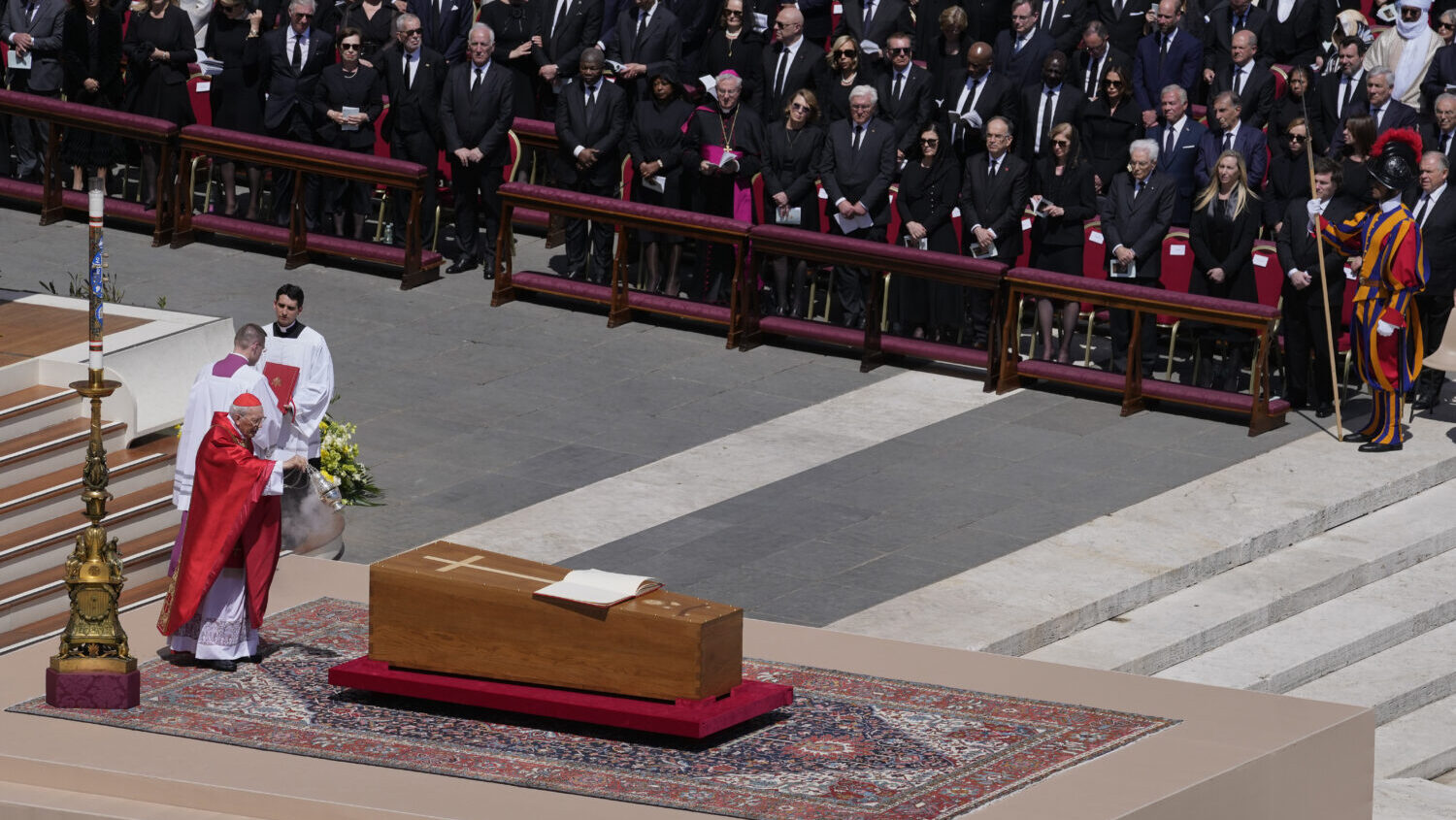Dean of the College of Cardinals Giovanni Battista Re spreads incense around the coffin of Pope Fra...