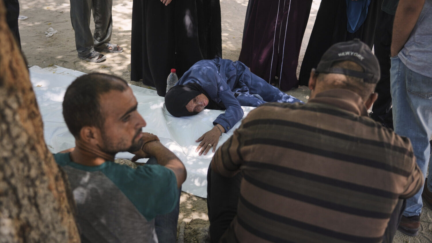 The mother of Raafat Al-Rubaie mourns over his body at a clinic in Gaza City on Sunday, July 20, 20...