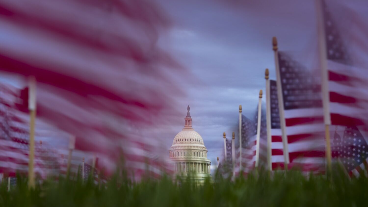 American flags planted to commemorate lung cancer victims fly in the wind along the National Mall o...