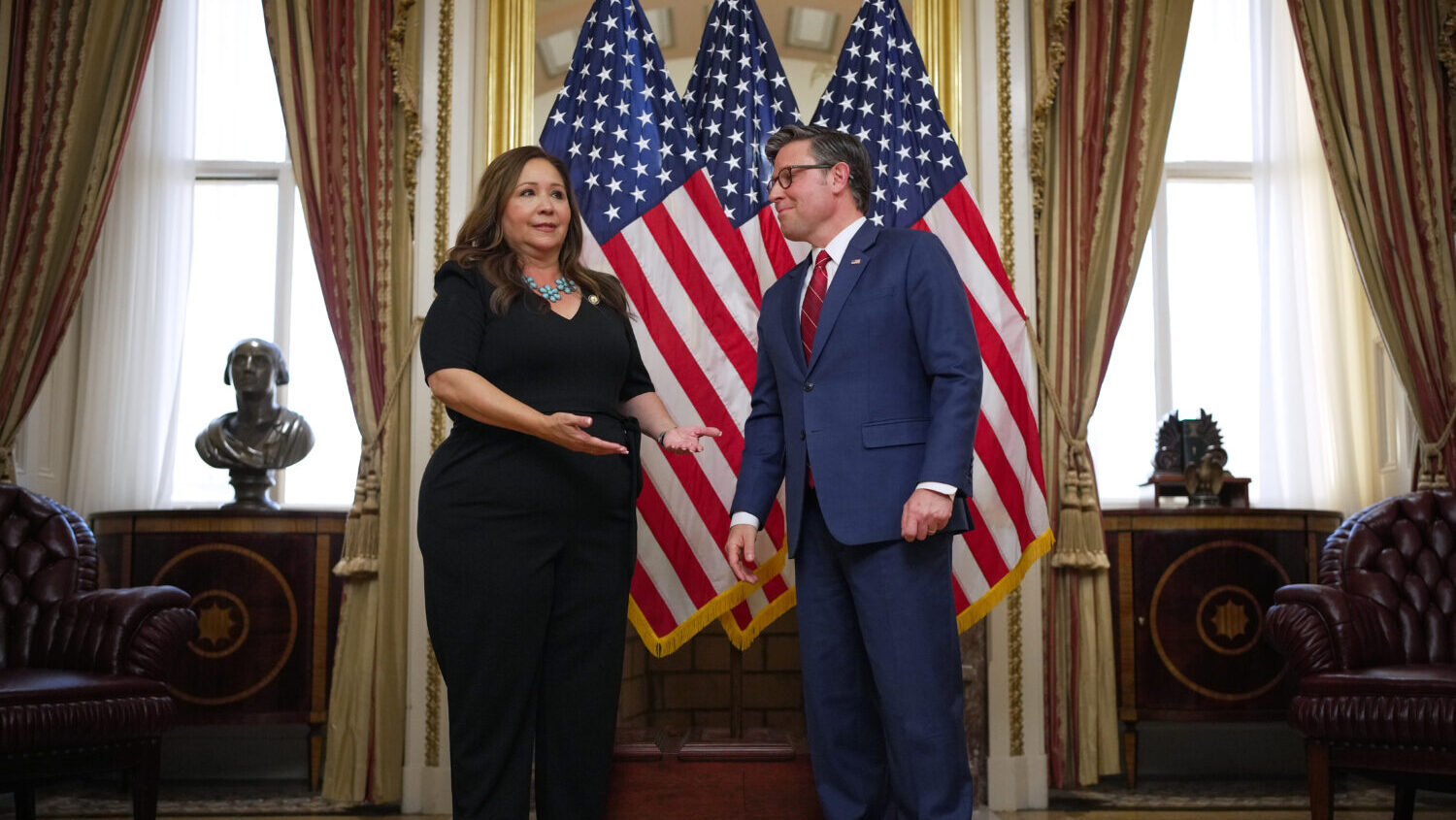 (L-R) U.S. Rep. Adelita Grijalva (D-AZ) gestures to Speaker of the House Mike Johnson (R-LA) as sh...
