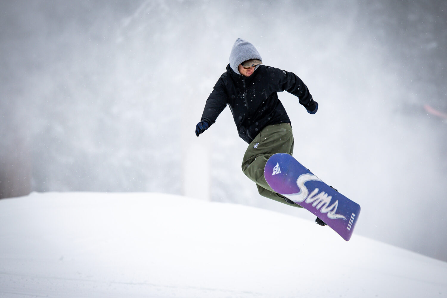 A snowboarder gets some air during opening day at Brighton Resort in Brighton on Tuesday, Dec. 2, 2...