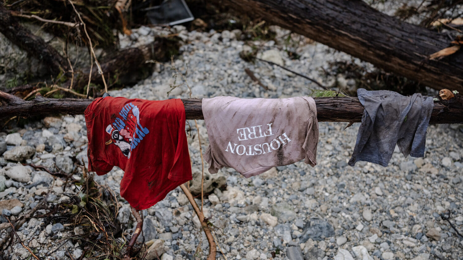 FILE: Children's clothes hang on the branch of a tree on the bank of the Guadalupe River near Camp ...