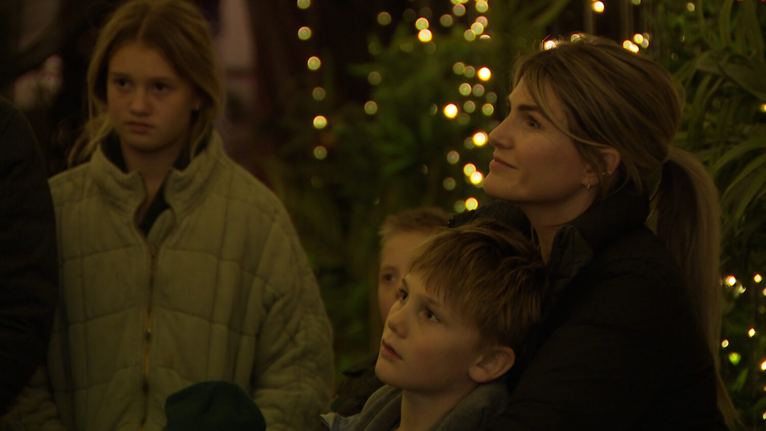 Attendees gather at the 'A Babe is Born' event to see a live nativity and donate to those in need d...
