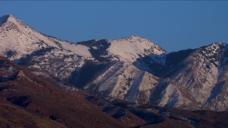 Snow is pictured on the mountains above Draper....
