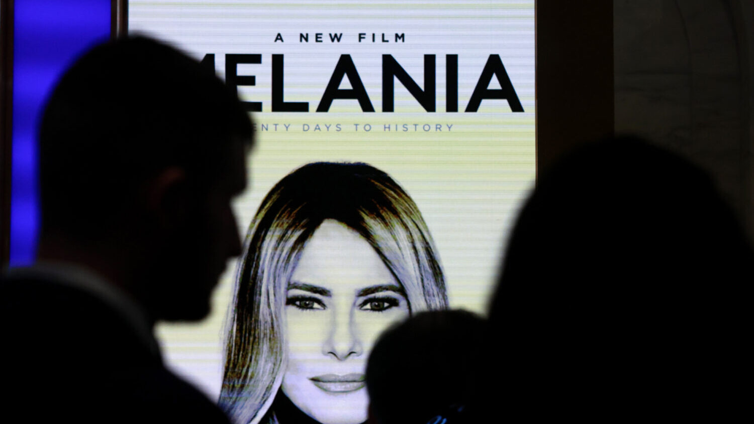 Advertisements for the First Lady's new film are displayed as Melania Trump appears at the New York...