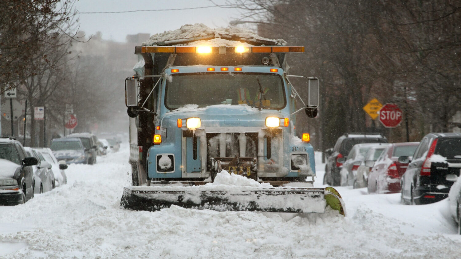 A city plow clears a residential street in the Bucktown neighborhood February 2, 2011 in Chicago, I...