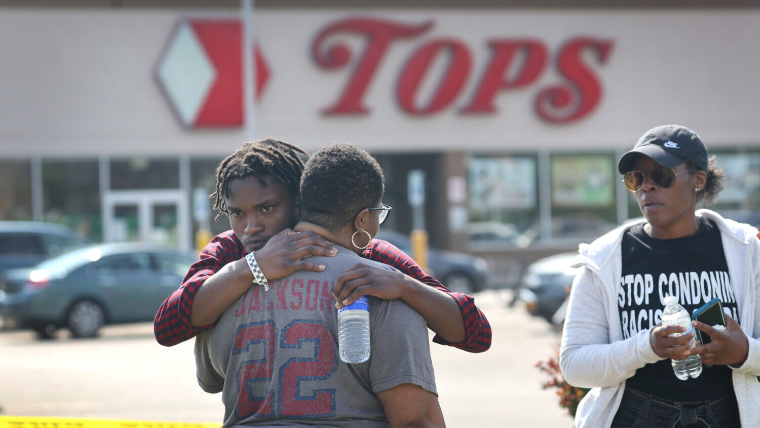 People gathered outside of Tops market embrace on May 15, 2022 in Buffalo, New York....