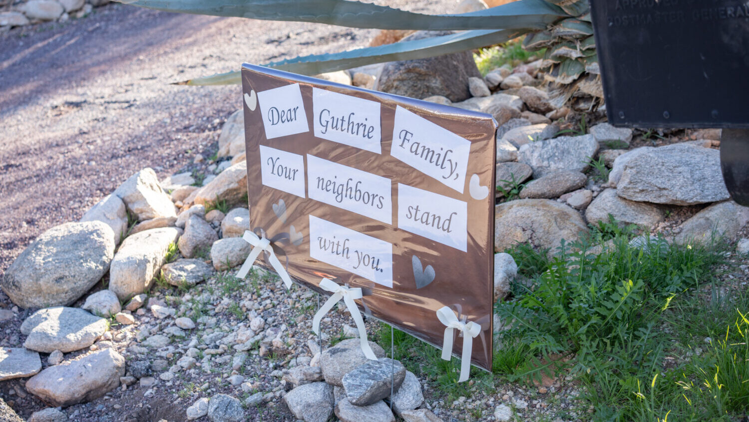 A sign is posted at the house of Nancy Guthrie, NBC host Savannah Guthrie's mother, on February 3, ...