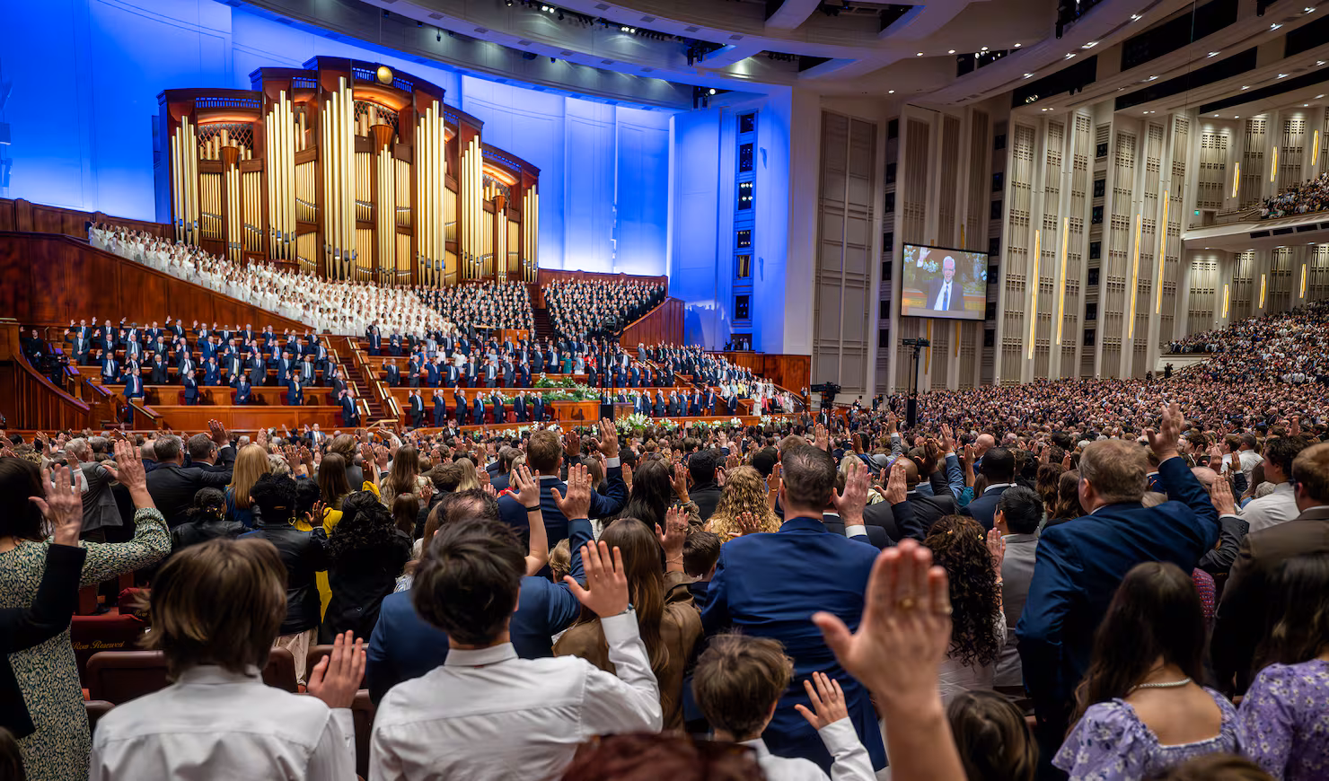 People in the audience participate in the solemn assembly at the 196th Annual General Conference of The Church of Jesus Christ of Latter-day Saints on Saturday, April 4, 2026. (Scott G Winterton, Deseret News)