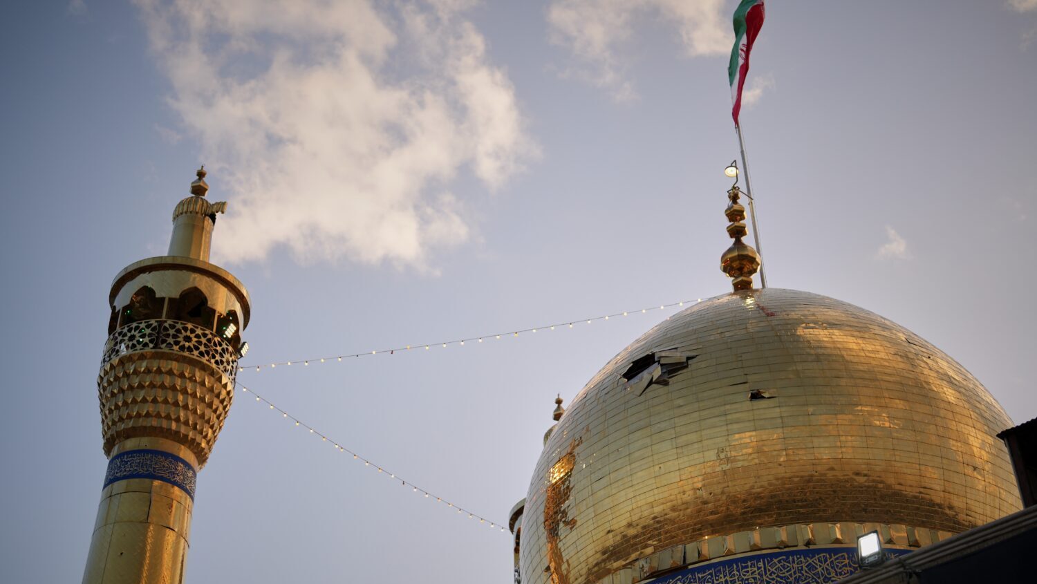 A hole is seen in the dome of the Grand Hosseiniyeh mosque that officials say was hit by U.S.-Israe...