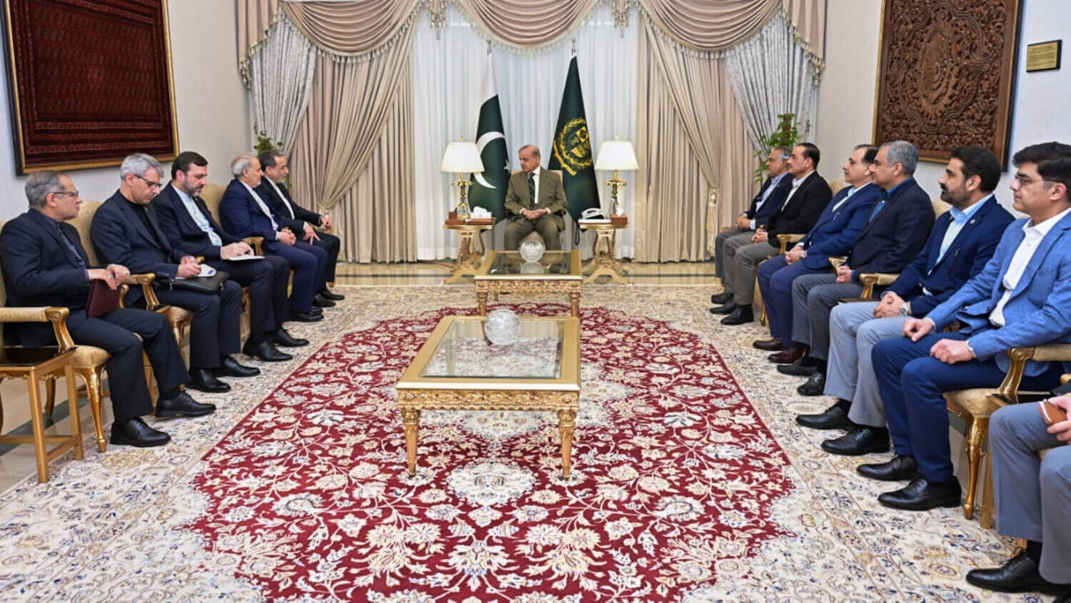 In this photo released by the Pakistan Prime Minister Office, Iran's Foreign Minister Abbas Araghch...