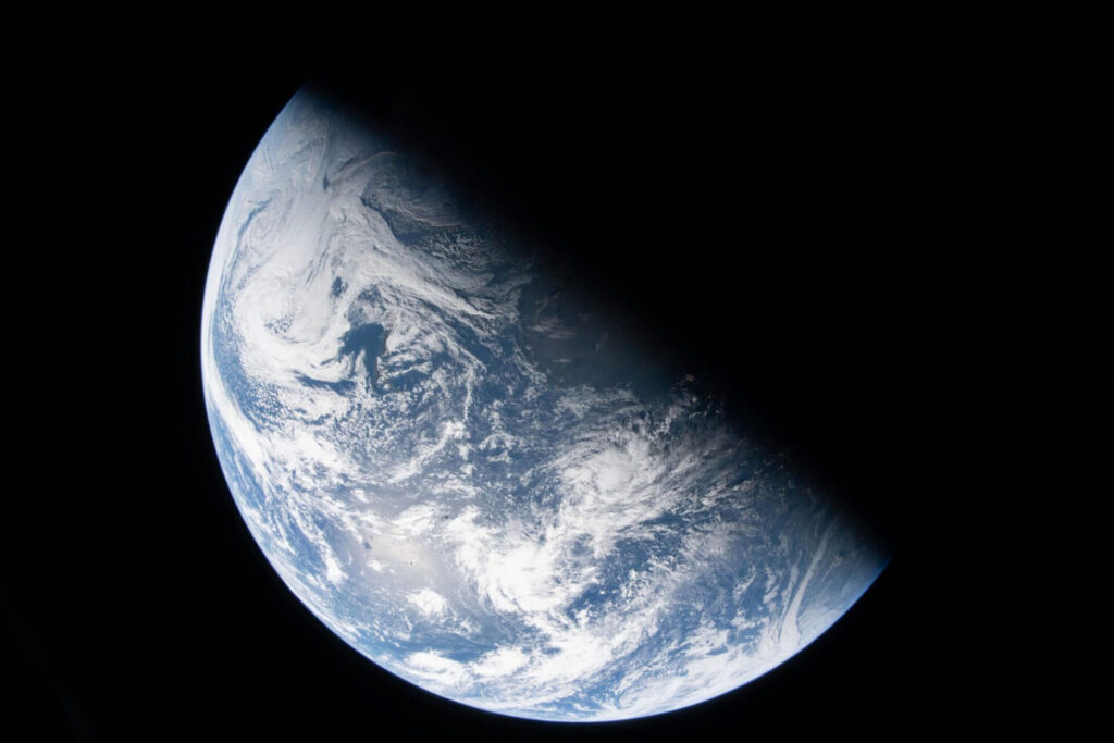 This image from video provided by NASA shows a view of earth taken by NASA astronaut and Artemis II Commander Reid Wiseman from one of the Orion spacecraft's four windows after completing the translunar injection burn, Thursday, April 2, 2026. 