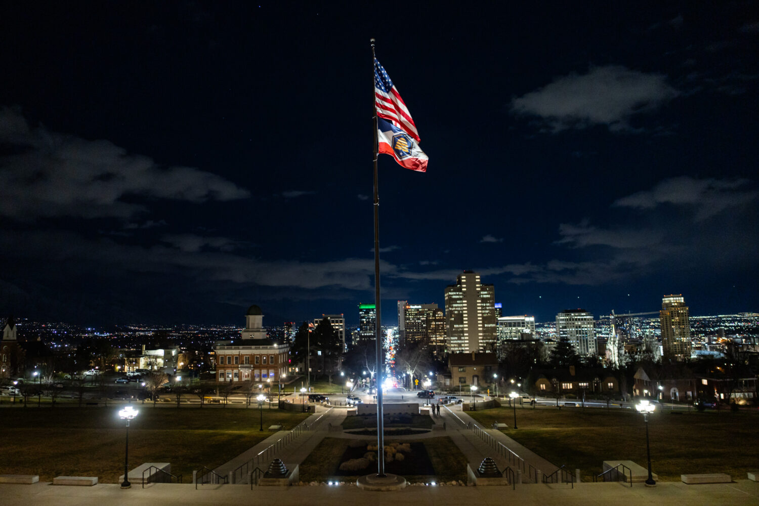 The American flag and Utah’s state flag blow in the wind during the last day of the legislative s...