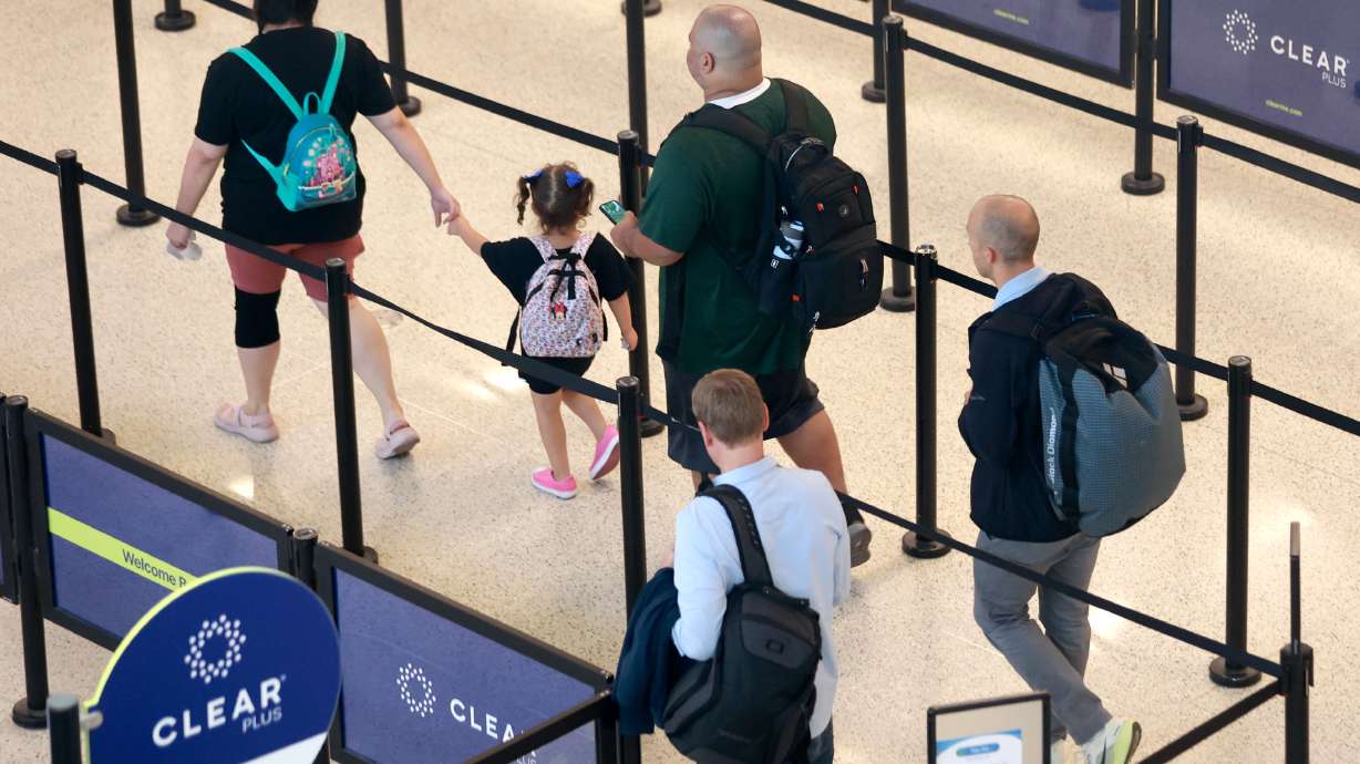 People walk through security at the Salt Lake City International Airport in Salt Lake City on Sept....