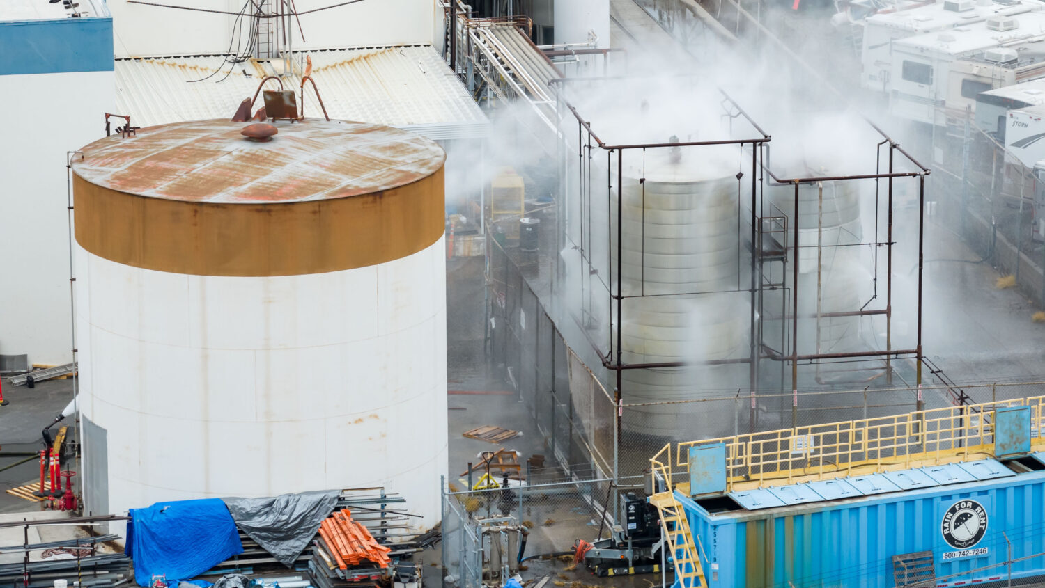 Water is sprayed on a damaged tank at GKN Aerospace in Garden Grove, Calif., on Sunday, May 24, 202...