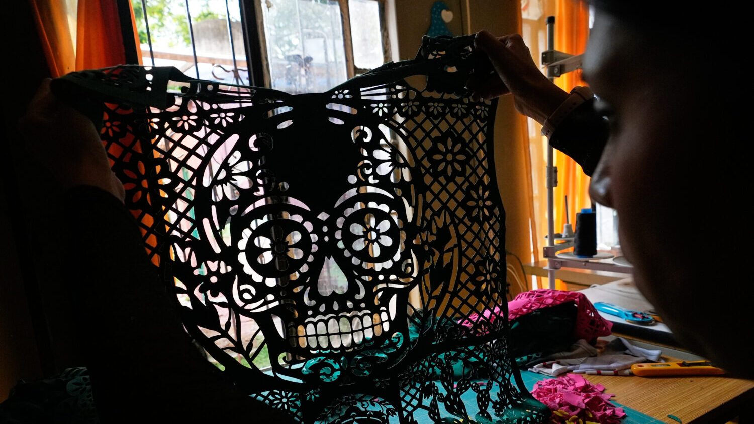 Cande Martinez prepares soccer jerseys, inspired by papel picado and traditional folk art, from the...