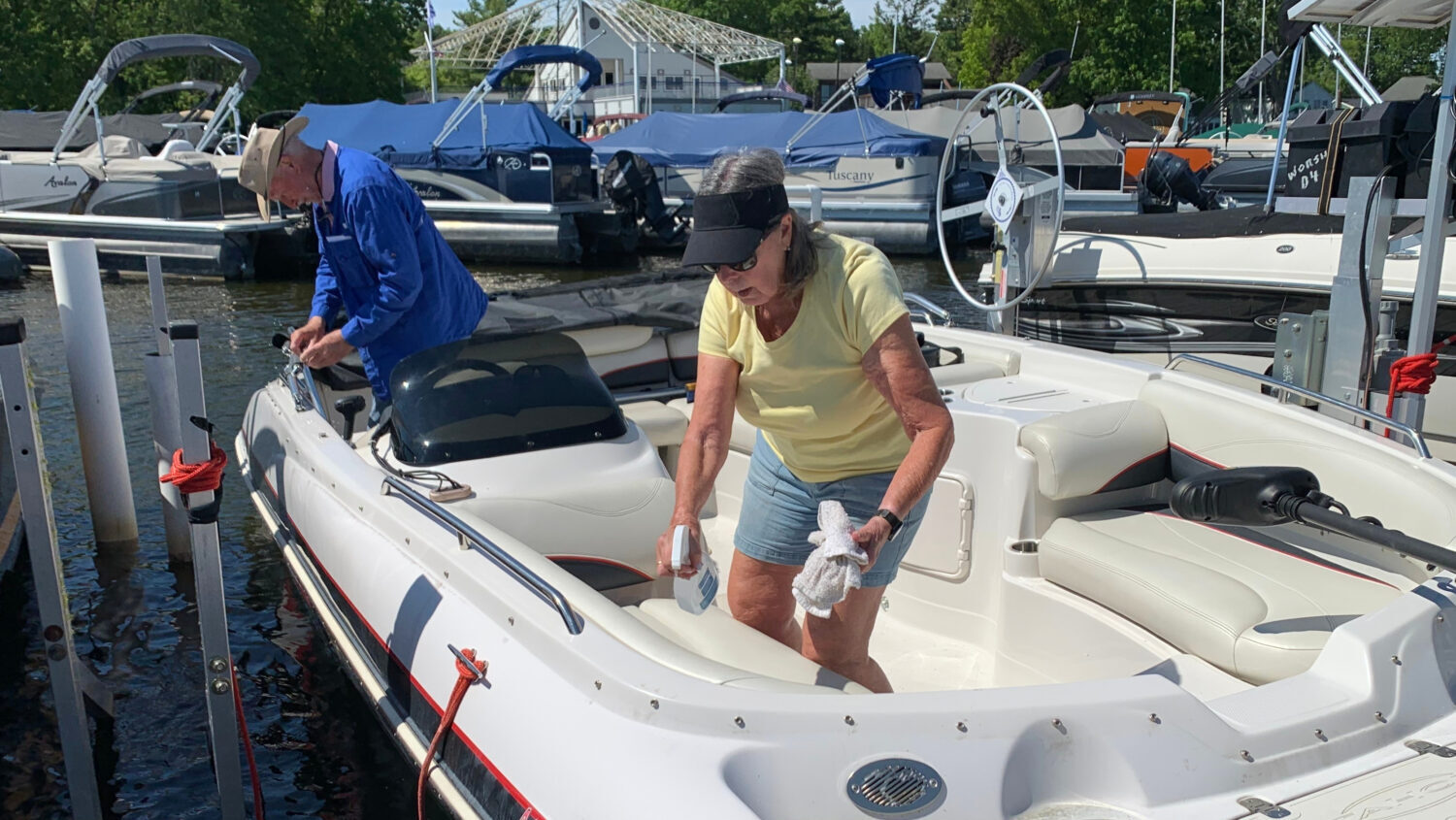 Kay Worsham cleans her boat Sunday, May 31, 2026, in Dexter Township, Mich....