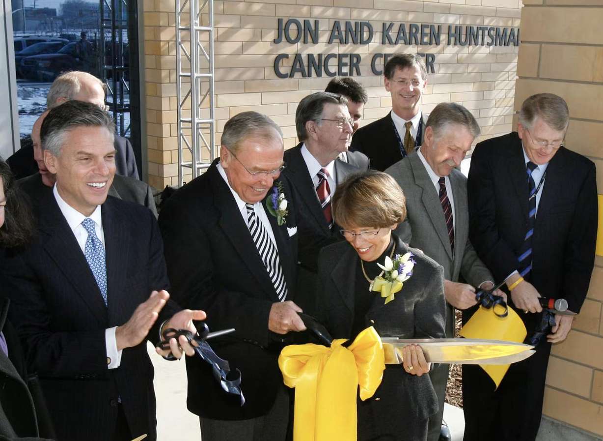 Gov. Jon Huntsman Jr. next to his parents Jon and Karen Huntsman as they cut the ribbon at the opening of the Jon and Karen Huntsman Cancer Center at Intermountain Hospital in Murray on Jan. 23, 2007.