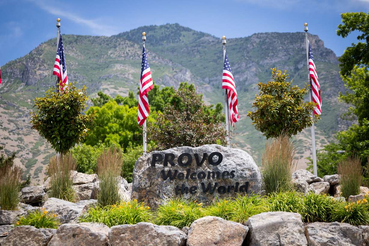 The words "Provo Welcomes the World" are seen on a rock on Center Street on Tuesday. Provo was named the best-run city in America by WalletHub. (Photo: Tess Crowley, Deseret News)