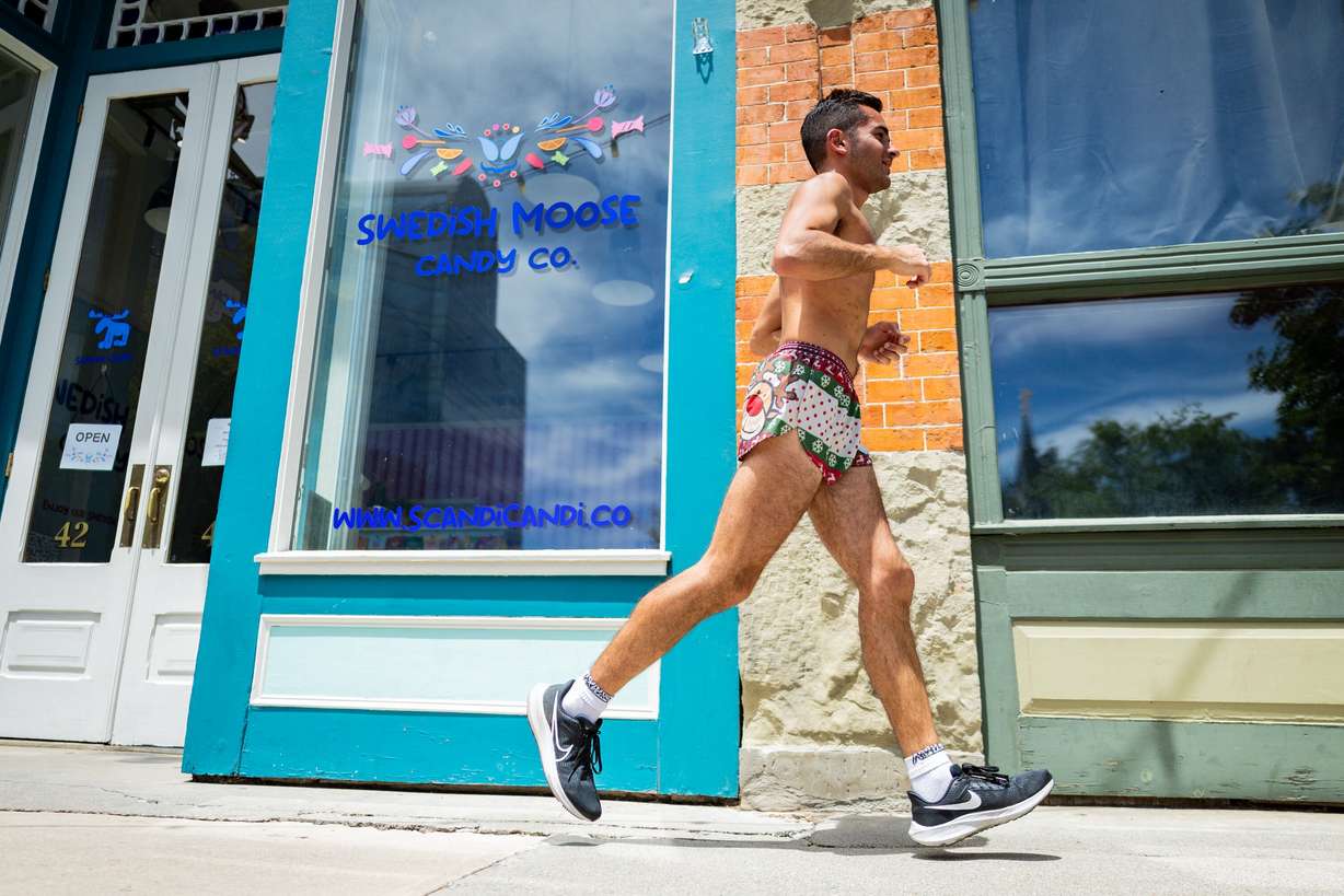 A runner passes by Swedish Moose Candy Co. on Center Street in Provo on Tuesday. The city is looking to build on its success after being named the best-run city in America two years in a row. (Photo: Tess Crowley, Deseret News)