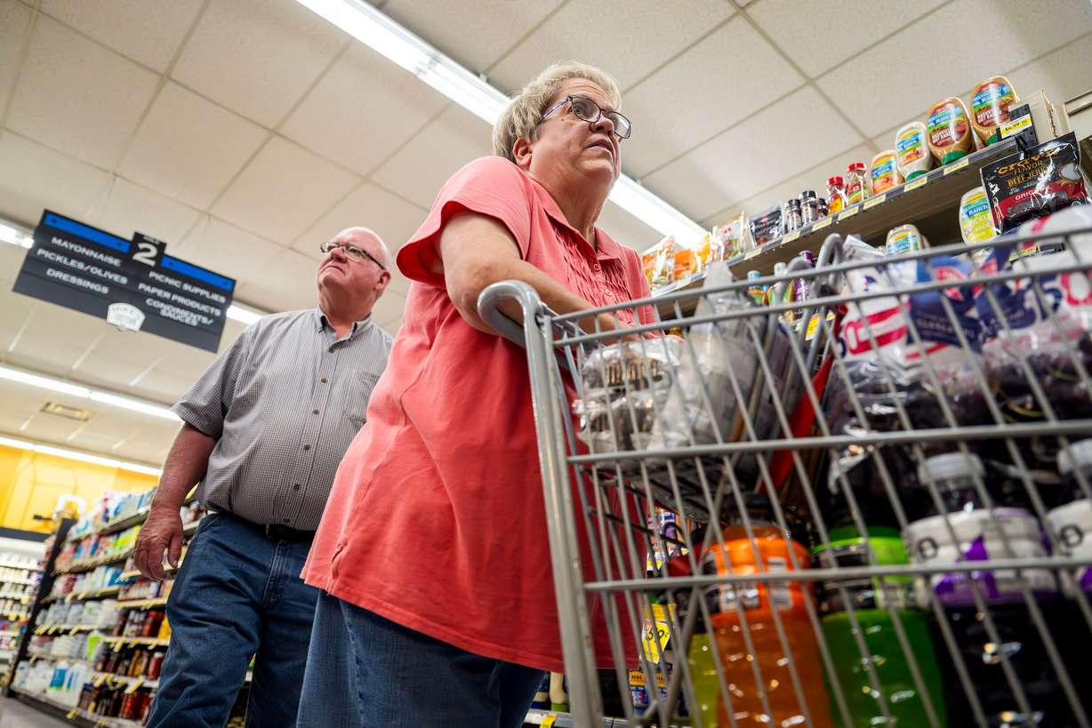 Brent and Susan Oldroyd, who were on the mountain when the Cottonwood Fire started, do a bit of shopping at a grocery store in Beaver on Monday. Susan Oldroyd recounted her and her husband's experience of when the fire started. (Photo: Scott G Winterton, Deseret News)