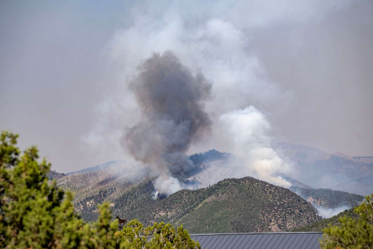The Cottonwood Fire burns on the mountains east of Beaver on Monday. Lynn Jenkins said he's never seen a fire that's been as devastating as the Cottonwood Fire. (Photo: Scott G Winterton, Deseret News)